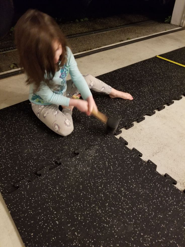 ![Child installing BYFIT gym flooring, easy installation, durable material](https://byfitgear.com/)